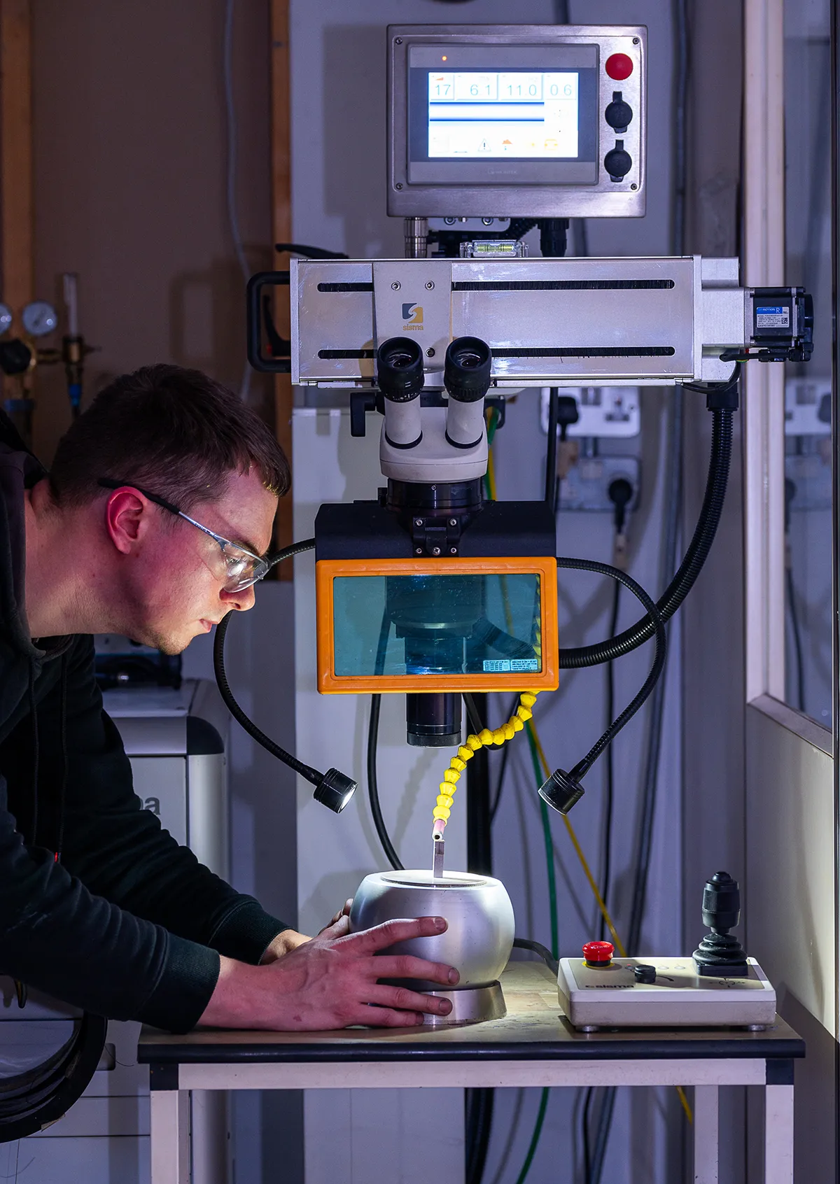 image of male tps employee working on a machine